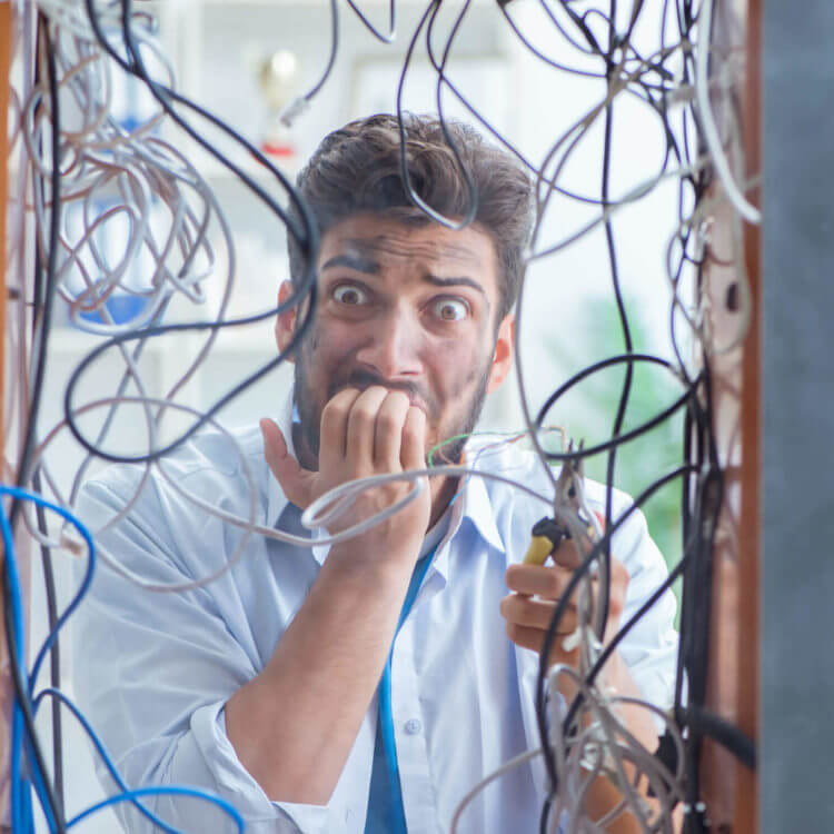 Electrician Trying To Untangle Wires In Repair Concept